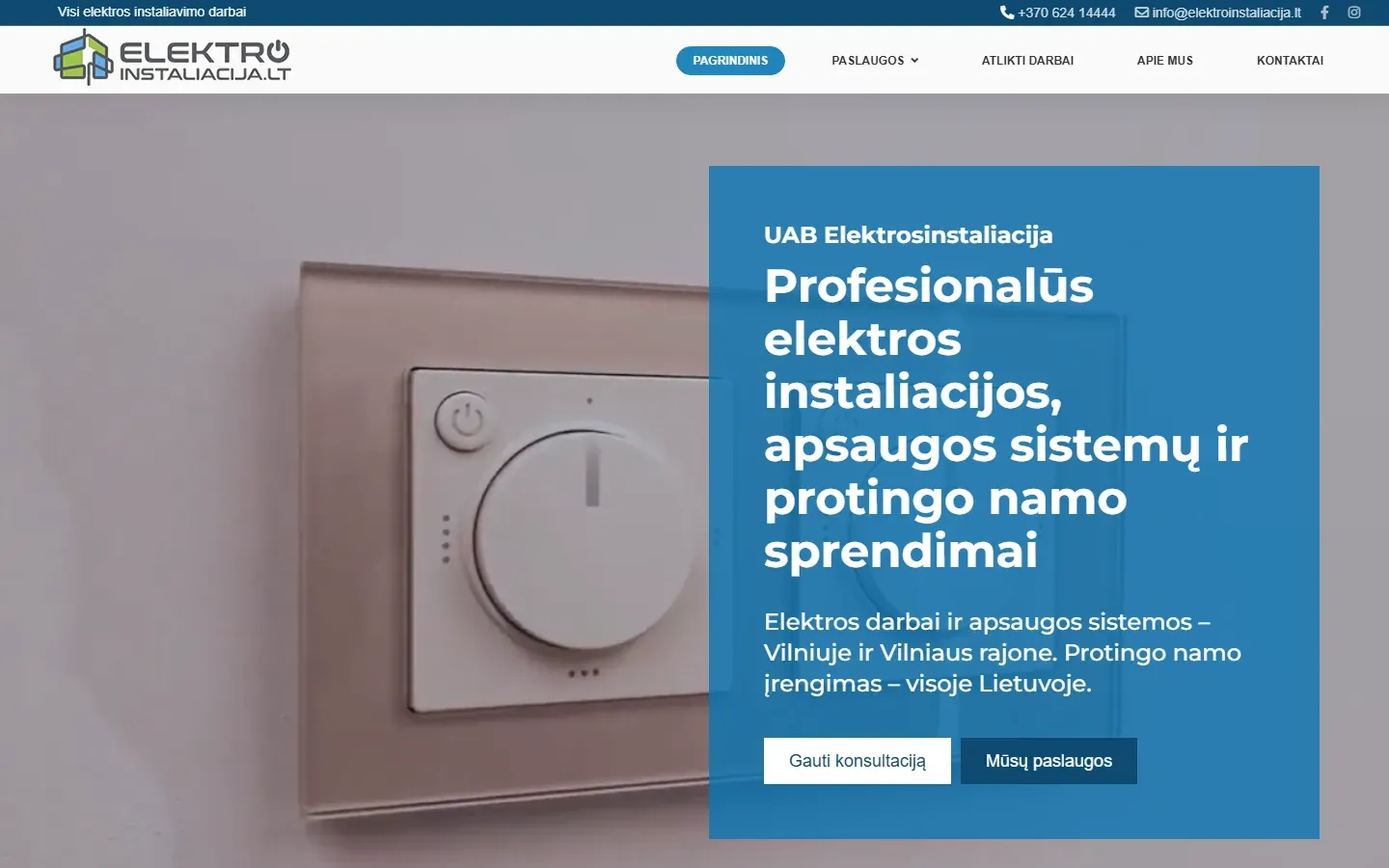 Atnaujinta elektroinstaliacija.lt svetainė: mėlynas pirmas ekranas su antrašte ir mygtukais